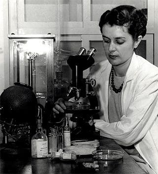 woman using microscope